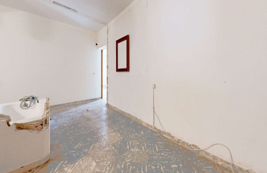 Townhouse in Pollenca Mallorca with large patio and renovation project